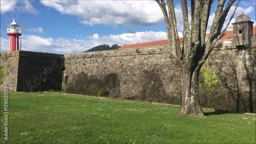 Castle wall with a naval lighthouse inside, a historic landmark of the northern city of Viana do Castelo in Portugal