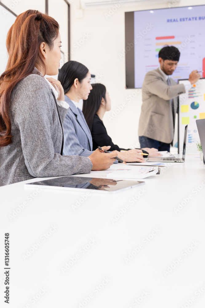 Fototapeta premium Group of business people working together with dashboard analysis and data management a meeting table in an office.