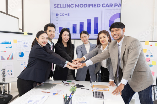 Happy excited asian business people teamwork brainstorm in modern office, successful start and good marketing plan concept.