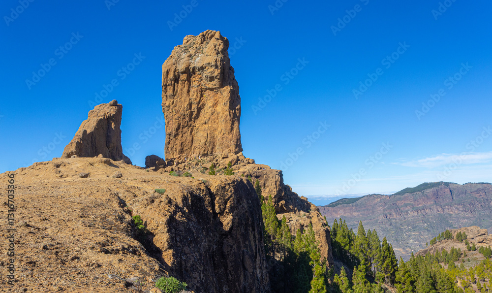 Fototapeta premium Roque nublo standing tall under blue sky in gran canaria, spain