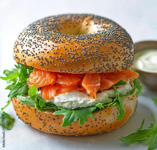 Delicious Bagel With Smoked Salmon, Cream Cheese, Arugula, and Dipping Sauce ...
