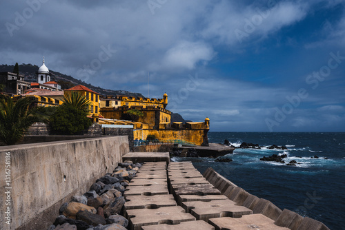 Madeira Funchal Portugal city surrounded ocean with old castle. The old castle in Funchal on the island of Madeira. It is a very popular tourist town.