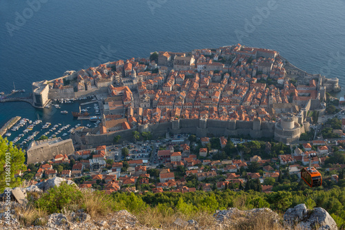 Aerial view of Dubrovnik Old Town and city walls at sunset