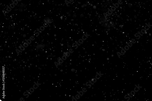 Texture of natural falling snow on black background.