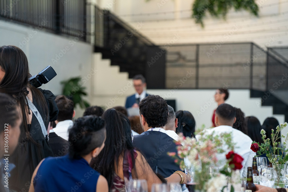 Fototapeta premium people watching at an event inside
