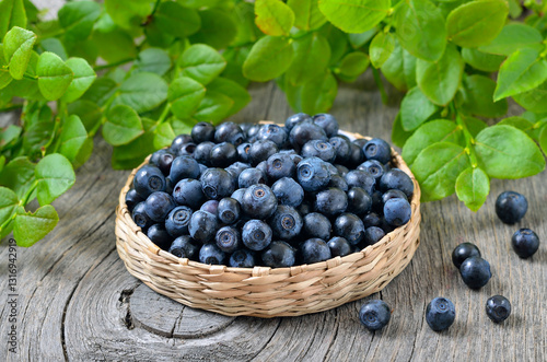 Fresh bilberry in a wicker basket