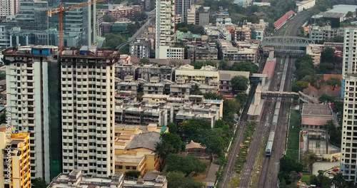Wallpaper Mural Morning Majesty: Aerial Glimpse of Mumbai's Skyline, Where Highrises Meet the Bustling Local Train Network Torontodigital.ca