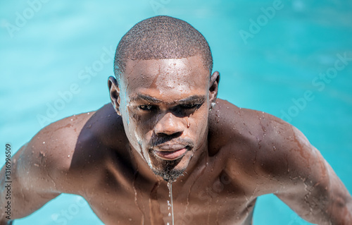 Intense Gaze of Afro-descendant Man in Water