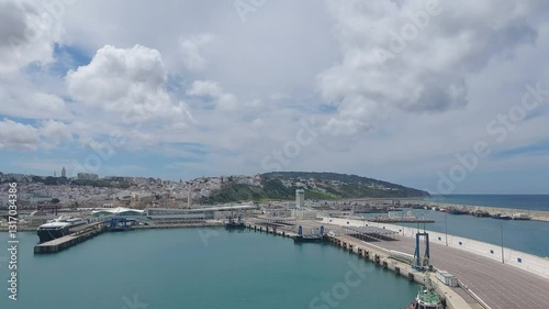 Moroco tangier apr 26 2024 Scenic View of Tangier Port and Cityscape Under Cloudy Skies
