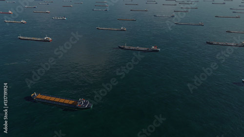 Aerial view, Oil tankers and gas ships waiting in the bay. Waiting to unload oil load from pipeline in the sea to wait for onward transportation. Commercial ships at sea. Large commercial cargo ships 