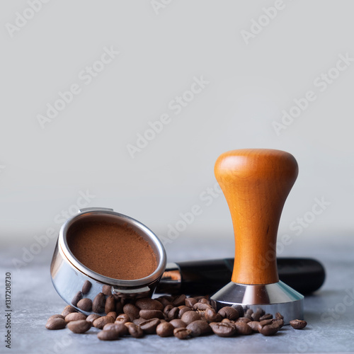 ground coffee tamped in a portafilter. tools for compressed coffee to make espresso.