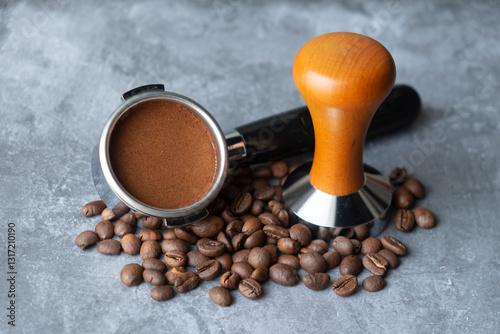 ground coffee tamped in a portafilter. tools for compressed coffee to make espresso.