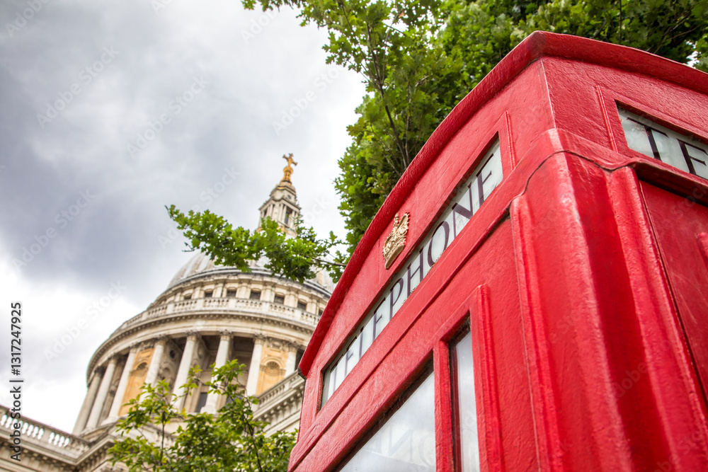 Detail of a traditional red London phone box with the dome of St Pauls Cathedral in the background. Space for text. Detail of a traditional red London phone box with the dome of St Pauls Cathedral in the background. Space for text.