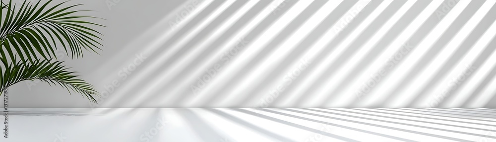 Fototapeta premium Green Leaf Plant Casting Shadows on Minimalist White Wall in Modern Indoor Setting