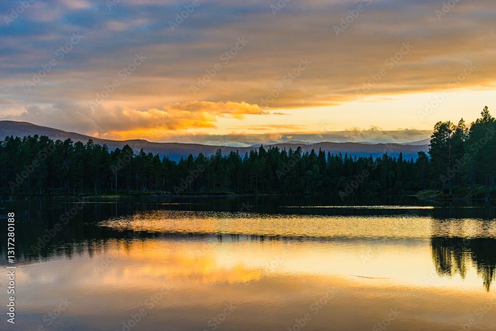Fototapeta premium Exploring the serene landscape of Sweden at sunset with golden reflections on a calm lake