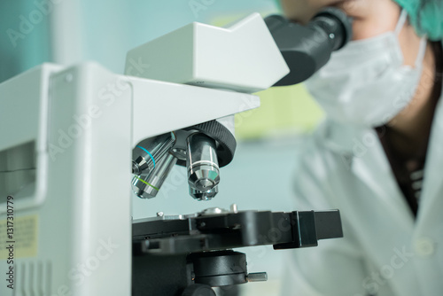 A laboratory technician makes microscopic bacteriological examination with the reagents. Work in micro laboratory.
