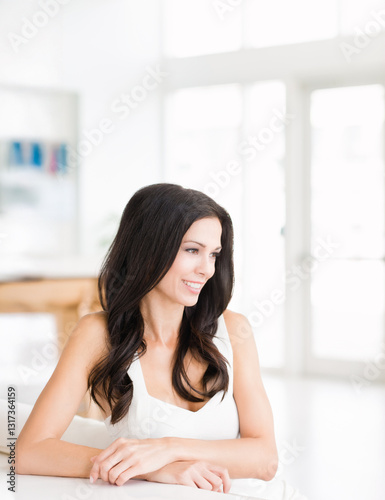 Beautiful young woman decorator real estate agent in bright modern showcase home Free Download Beautiful young woman decorator real estate agent in bright modern showcase home - GFXLoad