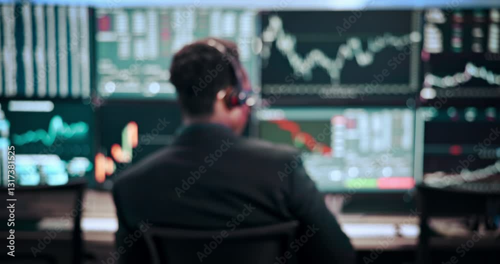 Man, back and screen with headphones for stock market investment, finance or monitoring graphs. Male person, broker or financial advisor with blur for trading advice or cryptocurrency at call center Man, back and screen with headphones for stock market investment, finance or monitoring graphs. Male person, broker or financial advisor with blur for trading advice or cryptocurrency at call center