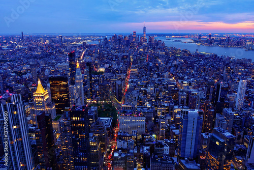 Panoramic views from the top of the Empire State Building over Manhattan Island in New York City at blue hour after sunset