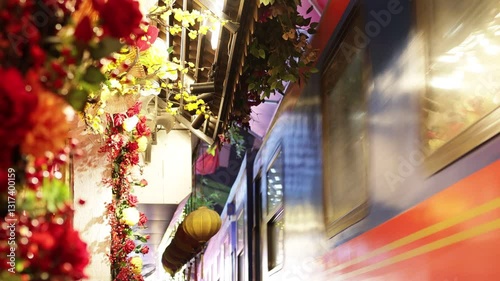 Train passes through narrow street.