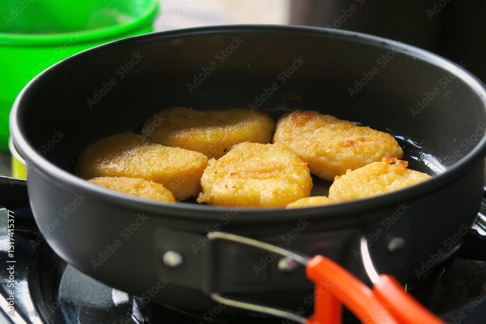 Golden Brown Chicken Nuggets Cooking in Pan Golden Brown Chicken Nuggets Cooking in Pan