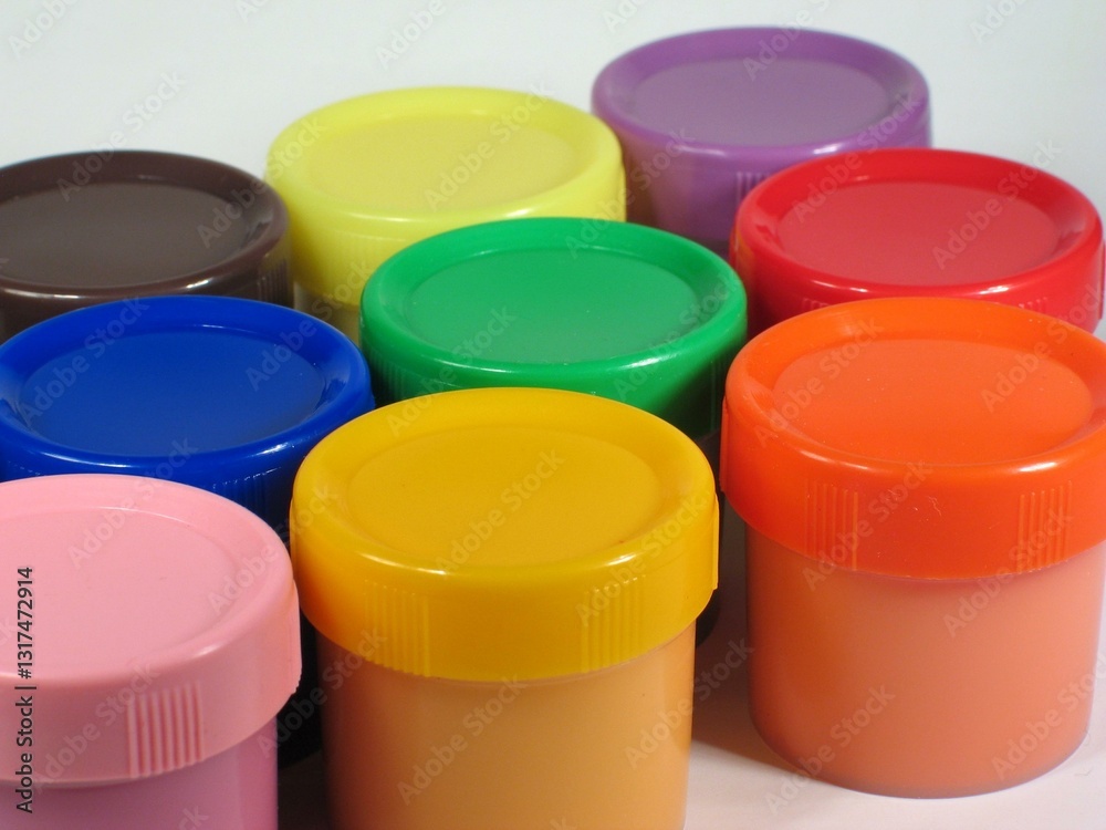 Colored paint cans over white background Colored paint cans over white background