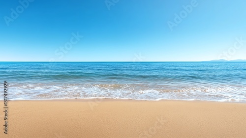A serene beach view showcasing golden sand and calm ocean waves under a clear blue sky, perfect for relaxation, vacation themes, or nature-related projects.