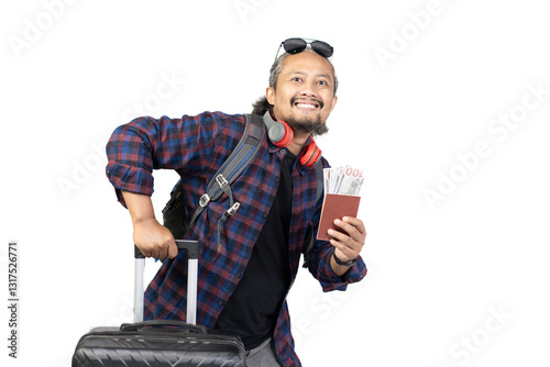 Curly-haired Indonesian man in a hurry carrying a suitcase and passport with money, travel concept, isolated on white background.