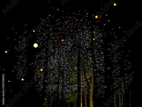 Obraz na płótnie A tree with many lights on it. The lights are yellow and they are falling from the tree w salonie
