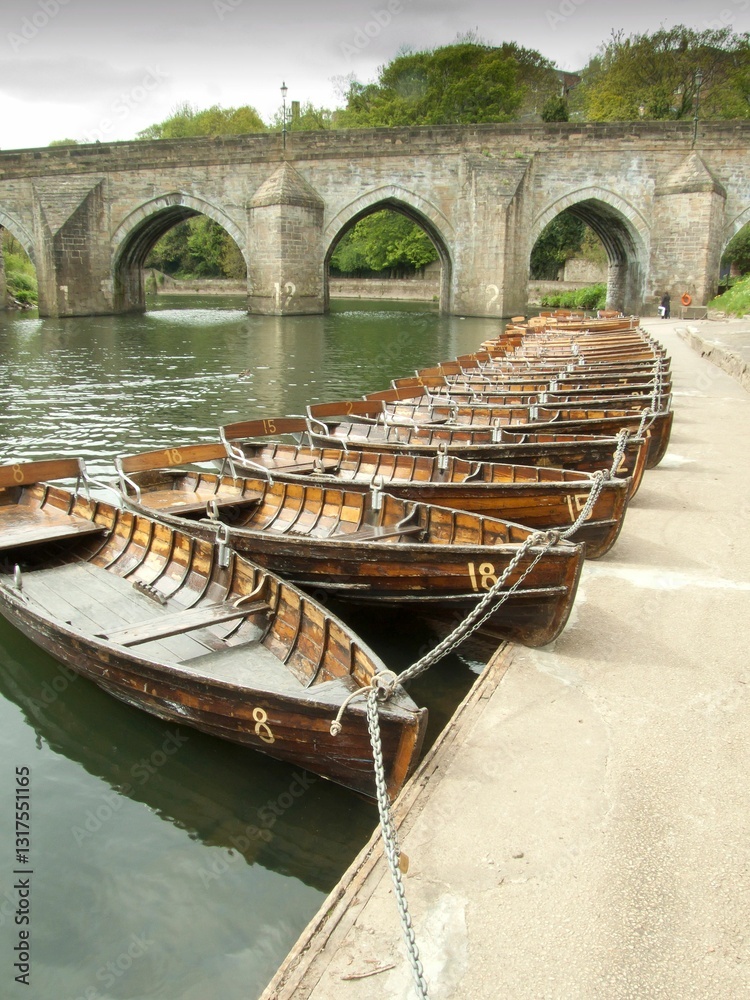 Rowing boats tied up on the river bank in Durham City, UK Rowing boats tied up on the river bank in Durham City, UK