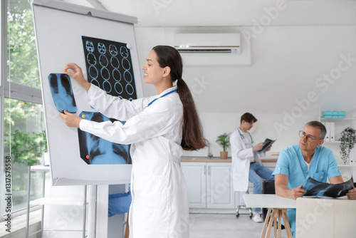 Female doctor putting x-ray...