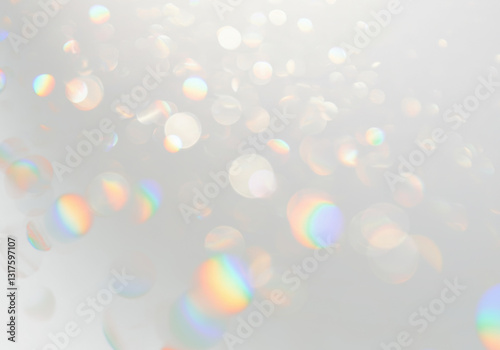 Dense bokeh effect with numerous diffused, round lights featuring iridescent rainbow edges and spectral colours, scattered across on transparent background