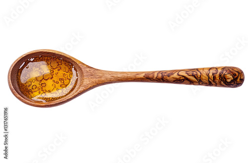Wooden spoon filled with golden liquid, top view, honey or oil