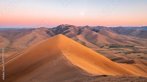 Rolling landscape of hills with varying shapes and colors at sunset