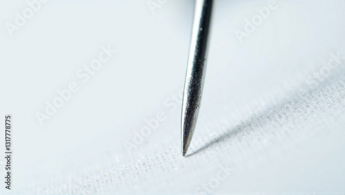 Extreme Macro Photography of Needle Tip on White Fabric - Generative AI