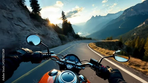 A motorcycle speeds along a winding mountain road, capturing the open road and nature.