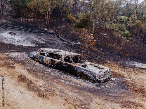 Aftermath of the devastating wildfire in LNU Lightning Complex wildfires in 2020. Burned out cars and debris litter the landscape, showing the destructive power of nature. photo