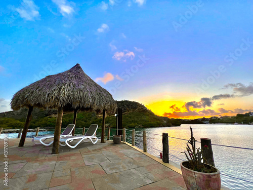 swimming pool Lounge chairs under a palapa overlooking the ocean