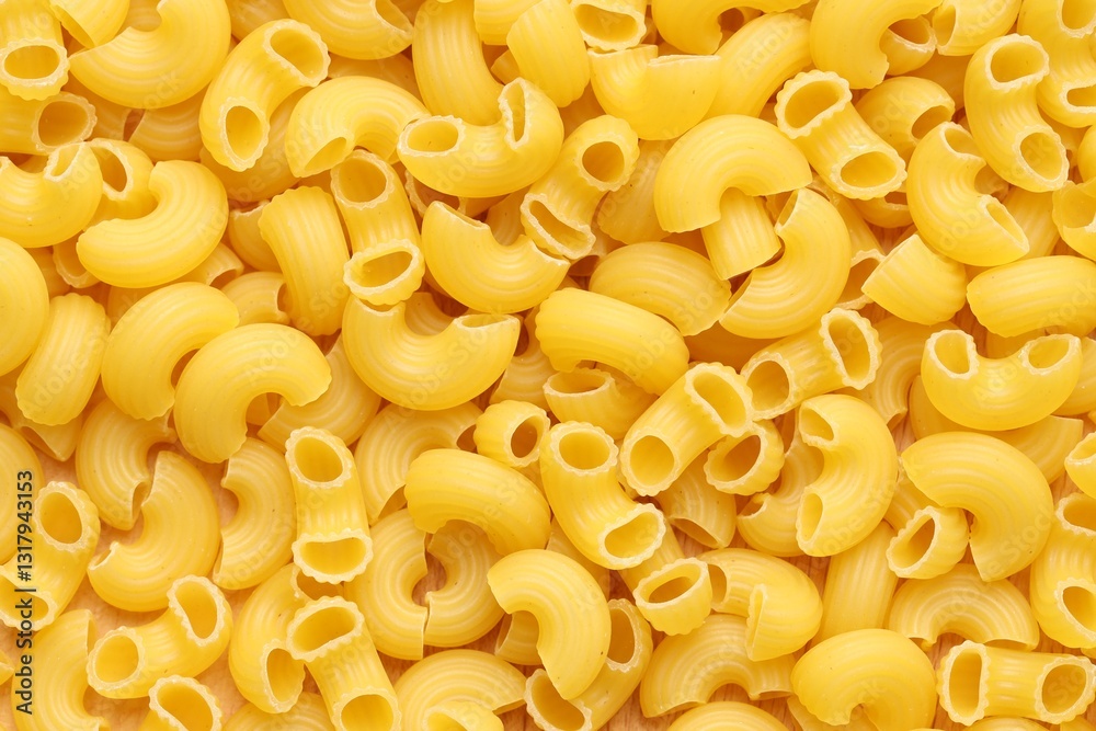 Raw horns pasta as background, top view Raw horns pasta as background, top view
