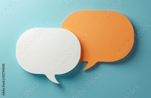 Two blank color paper speech bubbles for your design. White and orange dialogs on blue background. Flat lay top view, discussion template. Communication concept, place for talk, idea and text.