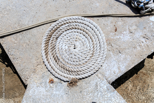 Europe, Spain, Balearic Islands, Mallorca, Santanyi, Cala Figuera . A small , colorful fishing harbor on Coiled rope.