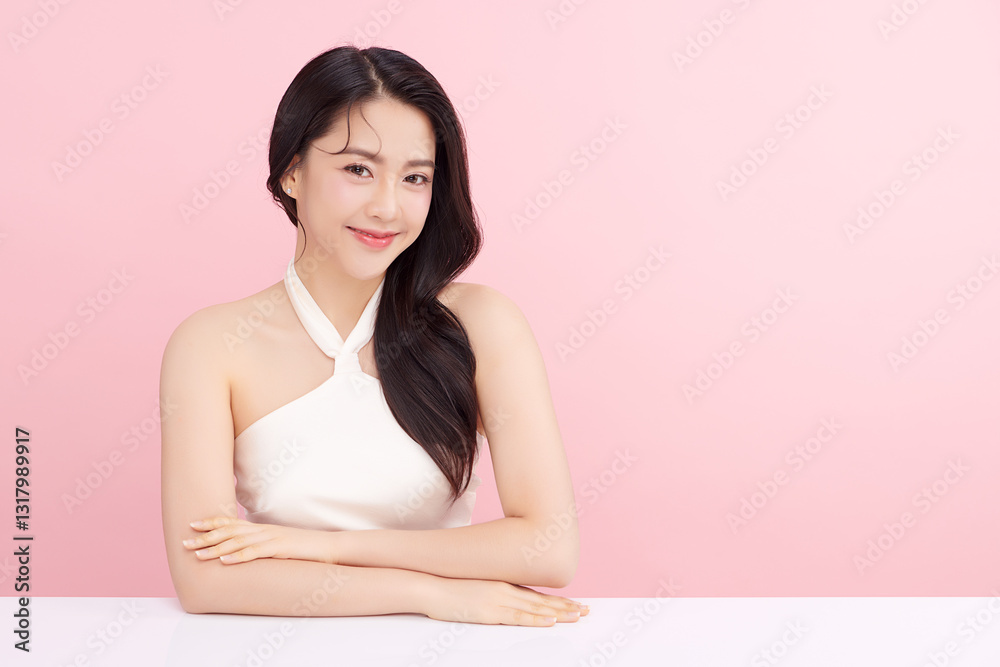 A beautiful young Asian woman with clean, fresh skin against a pink background. Skincare, facial treatment, cosmetology, beauty, and spa. An elegant portrait of an Asian woman. A beautiful young Asian woman with clean, fresh skin against a pink background. Skincare, facial treatment, cosmetology, beauty, and spa. An elegant portrait of an Asian woman.