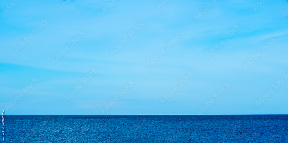 Fototapeta premium Nature of the beach and sea Summer with sunshine, sandy beaches, clear blue waters sparkling against the blue sky. On an island with good ecology and environment Background for summer vacation