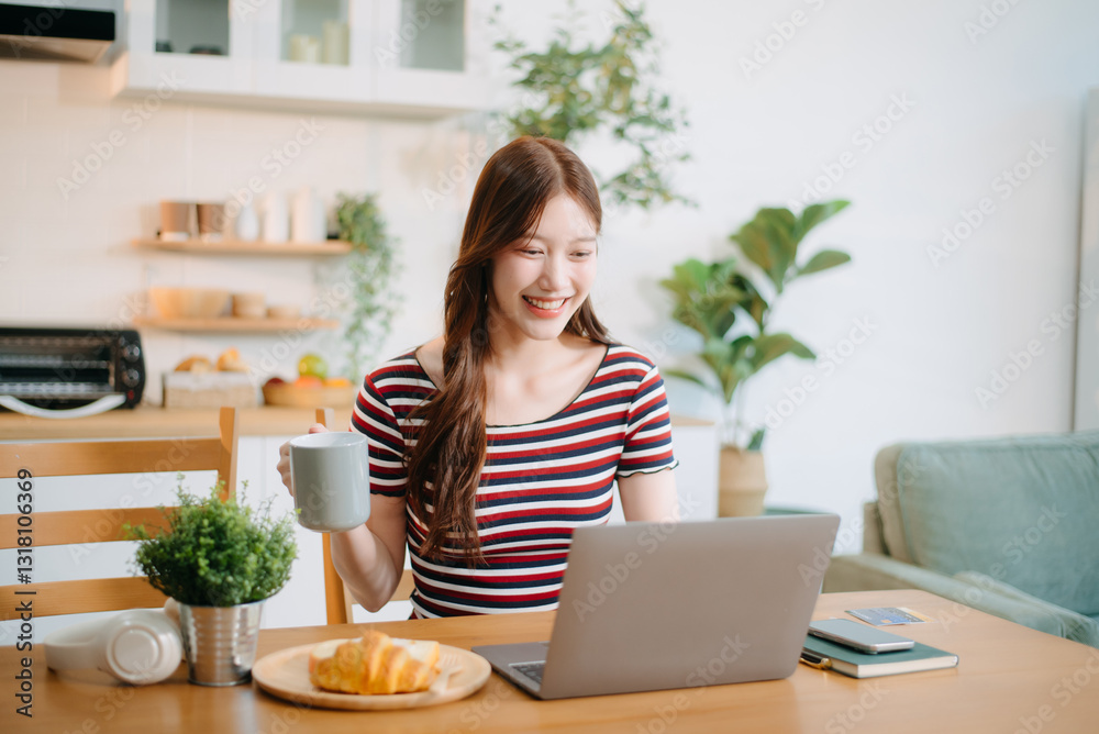 woman working remotely on a laptop and tablet in a cozy kitchen workspace. Perfect for education, freelance woman working remotely on a laptop and tablet in a cozy kitchen workspace. Perfect for education, freelance