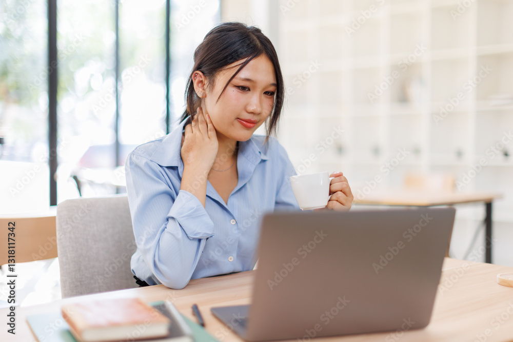 Young asian female entrepreneur working on a laptop at business meeting in a corporate workplace.
Young asian female entrepreneur working on a laptop at business meeting in a corporate workplace.