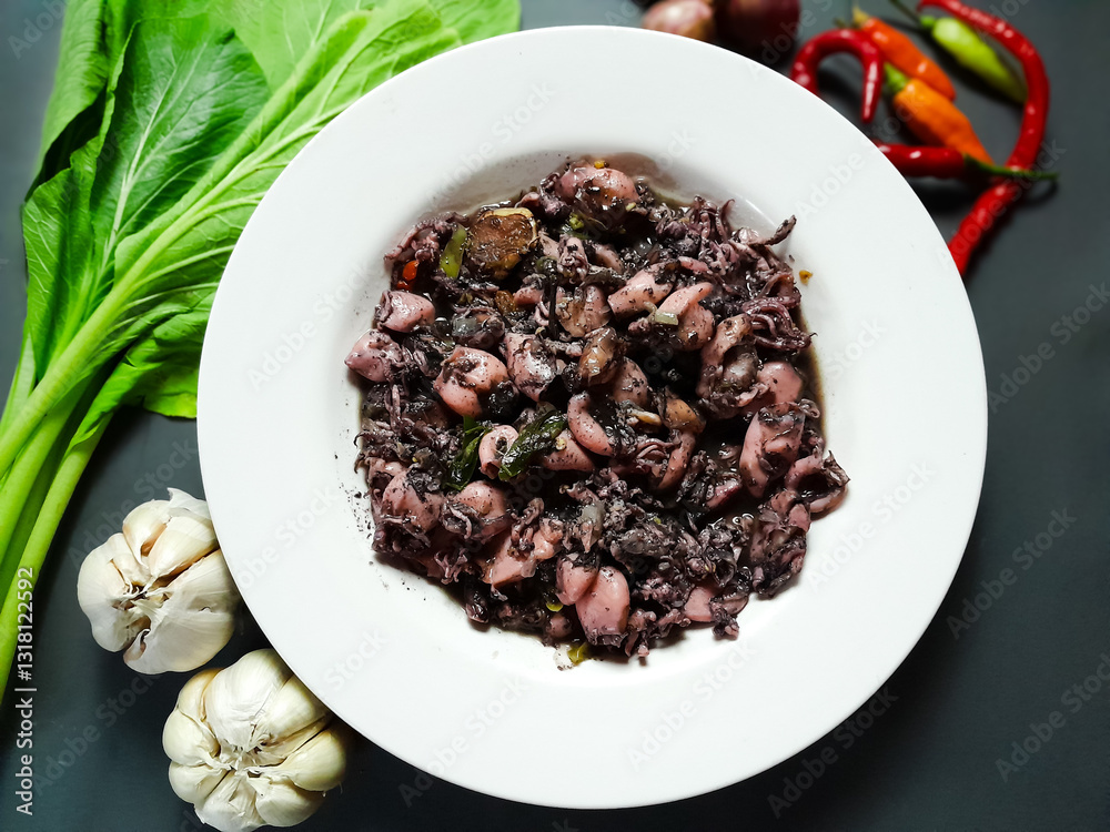 Black Squid, Indonesian Food. Food that is widely loved by the people Black Squid, Indonesian Food. Food that is widely loved by the people