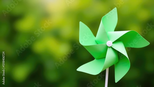 ESG and clean energy concept featuring a paper windmill on a green background. Sustainable resources. Investment in green enterprises. Minimizing carbon emissions and generating clean and sustainab...