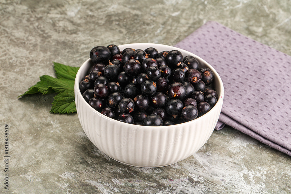 Ripe black currant in the bowl Ripe black currant in the bowl