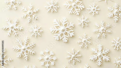 Detailed ivory snowflakes on a cream paper backdrop, overhead perspective.