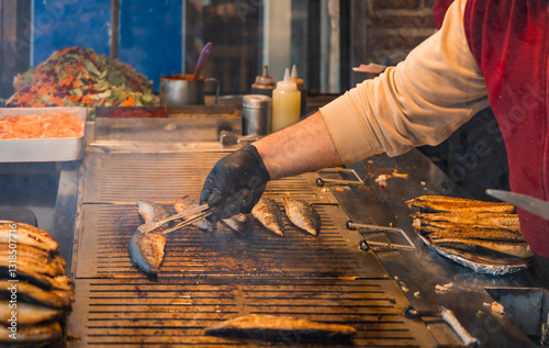 Bilde på lerret A street food vendor grills fresh fish at an outdoor market in Istanbul